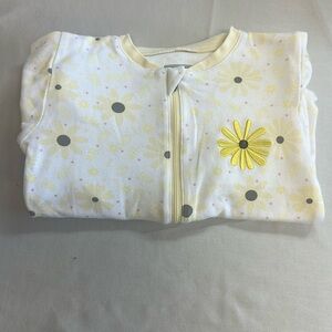 Tuffy - footed sleeper with embroidered daisy.